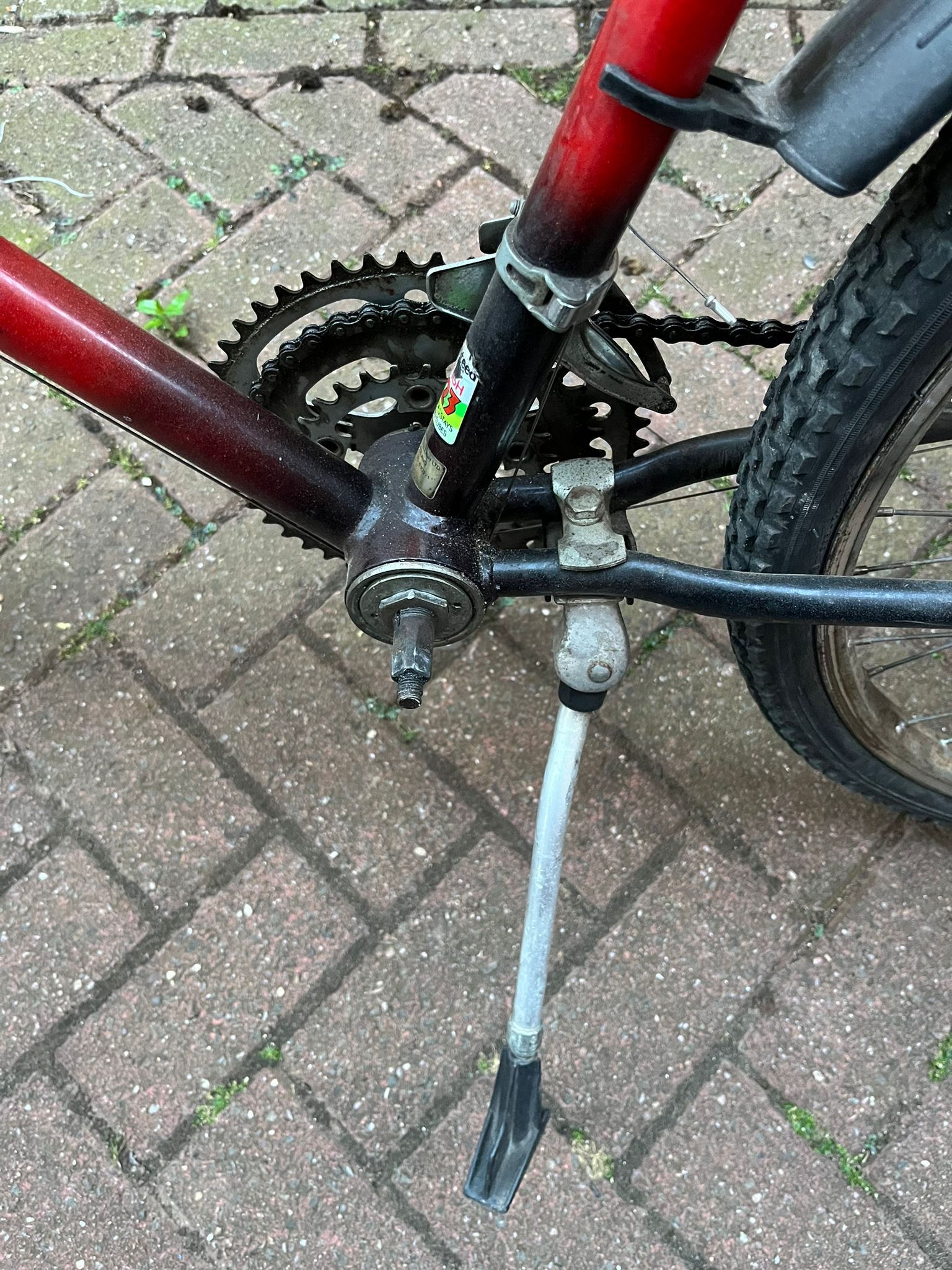 Close up the Raleigh bicycle drive train with the crank arm & pedal missing. 